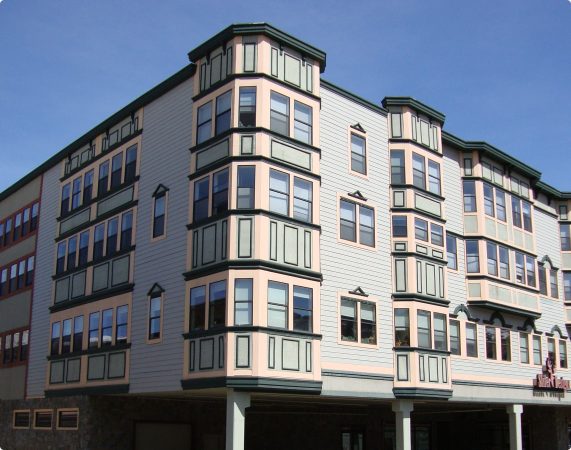 The beautiful front and windows of the Riverwalk fully finished by Showcase Drywall